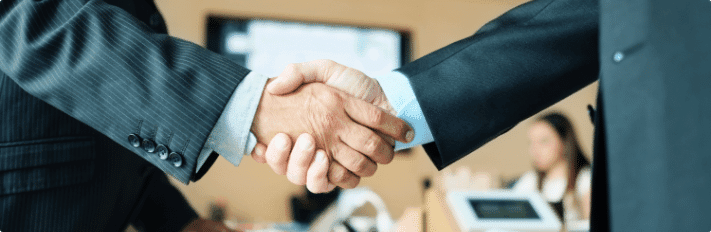 manager shaking hands with colleague after JFXV7UE